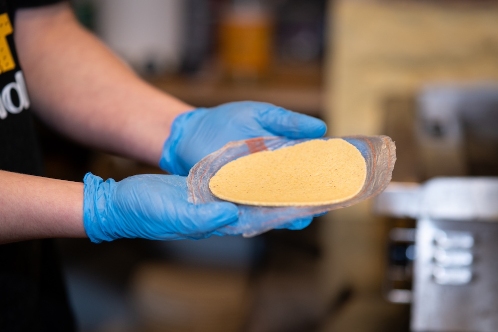 yellow corn tortilla ready to be grilled