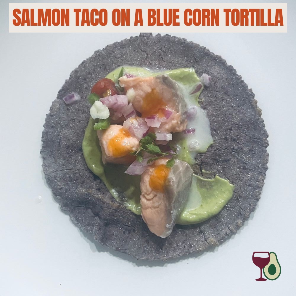 salmon taco on a blue corn tortilla