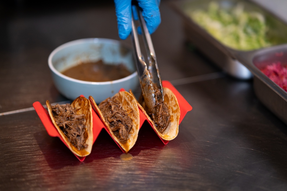 assembling birria tacos