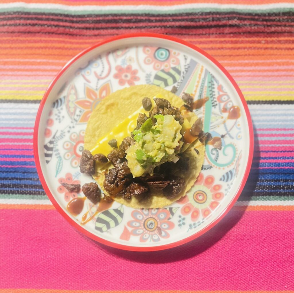 vegan steak taco (with Beyond Meat) with melted vegan cheddar cheese (Violife)