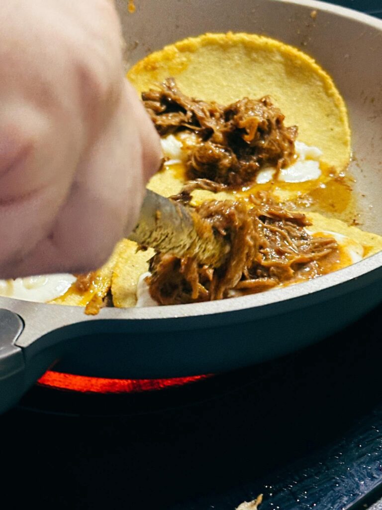 frying quesabirria tacos