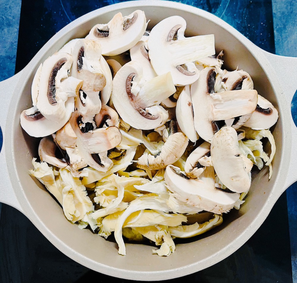 cut white mushrooms and oyster mushrooms